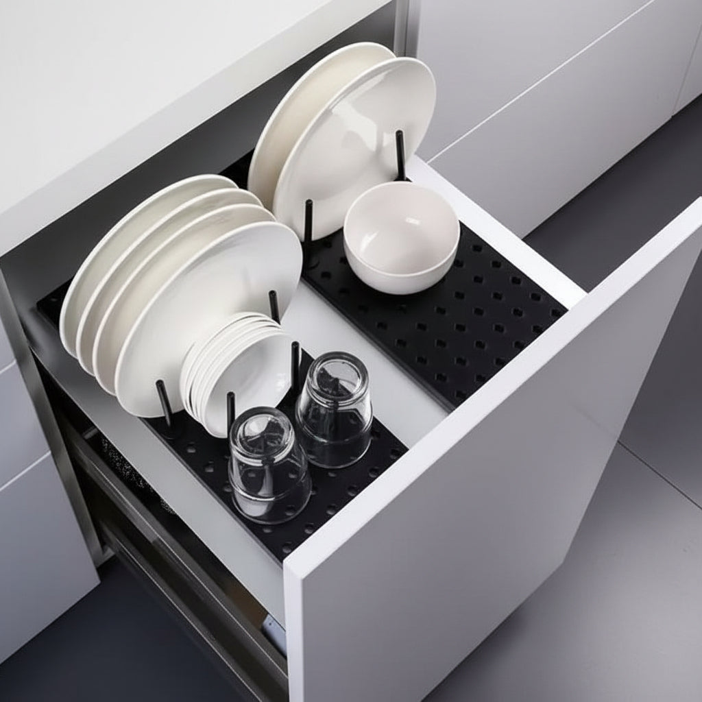 Dish rack with white dishes and a close-up of hands using it.